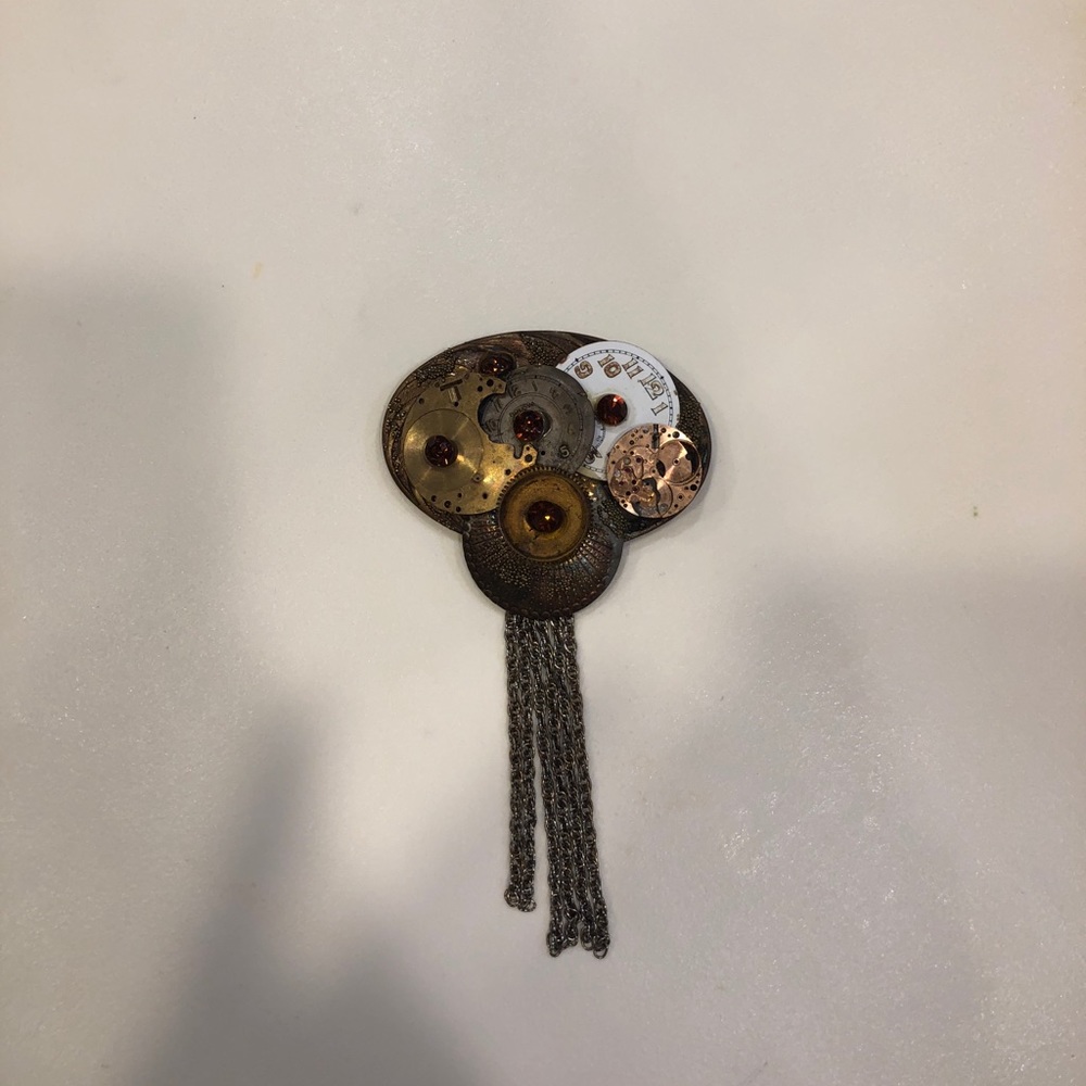 Pin with clock detail